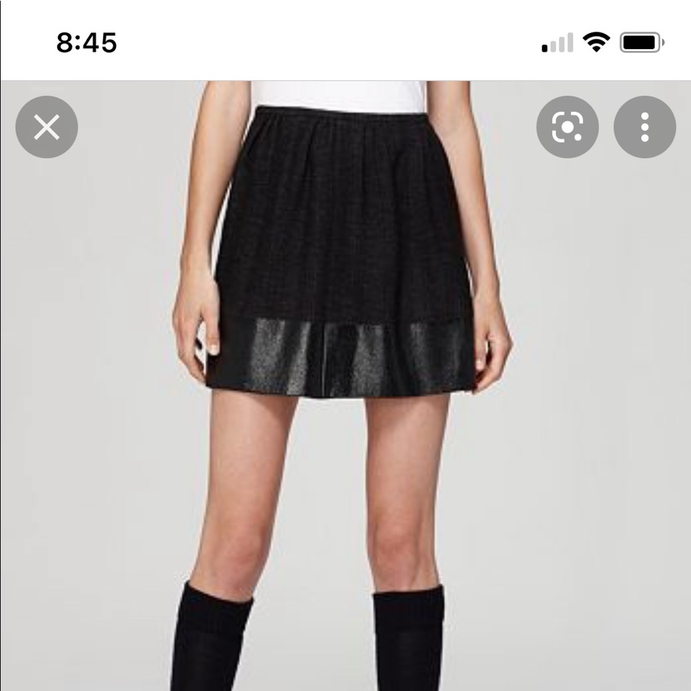 Cute, theory tweed suit skirt with shimmery contrast trim.